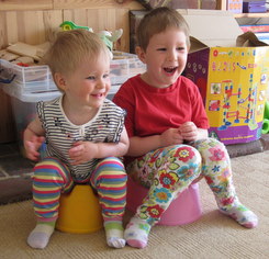 nearly 2 and nearly 4 - playing on the potties